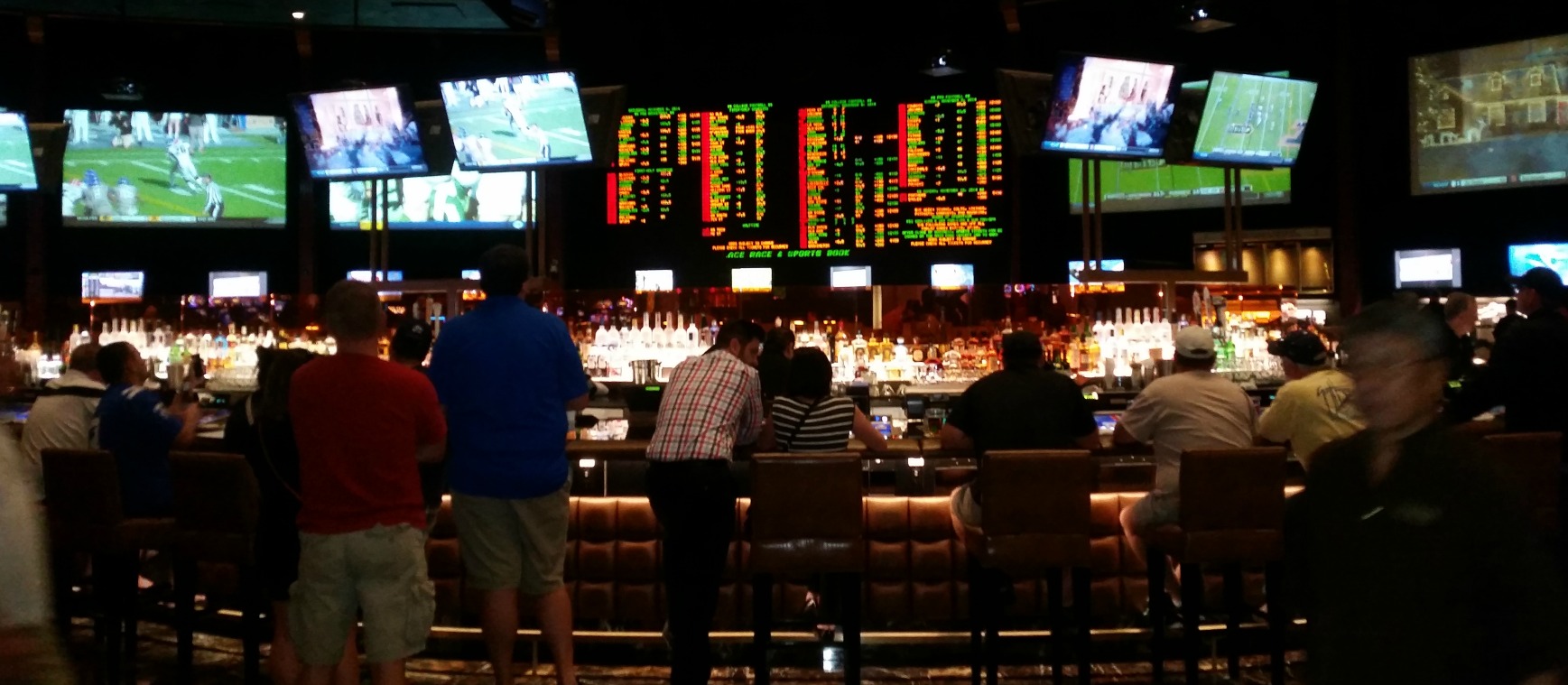 Video Poker at the Bar May Yield a Nice TV Screen for Watching Hoops  and Some Free Drinks  Pictured: Caesars Palace Sports Book Bar